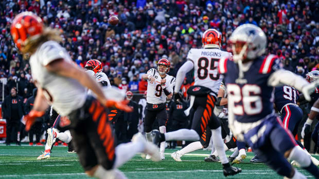 Dec 24, 2022; Foxborough, Massachusetts, USA; Cincinnati Bengals quarterback Joe Burrow (9) throws a touchdown pass to wide receiver Trenton Irwin (16) against the New England Patriots in the first half at Gillette Stadium. Mandatory Credit: David Butler II-USA TODAY Sports